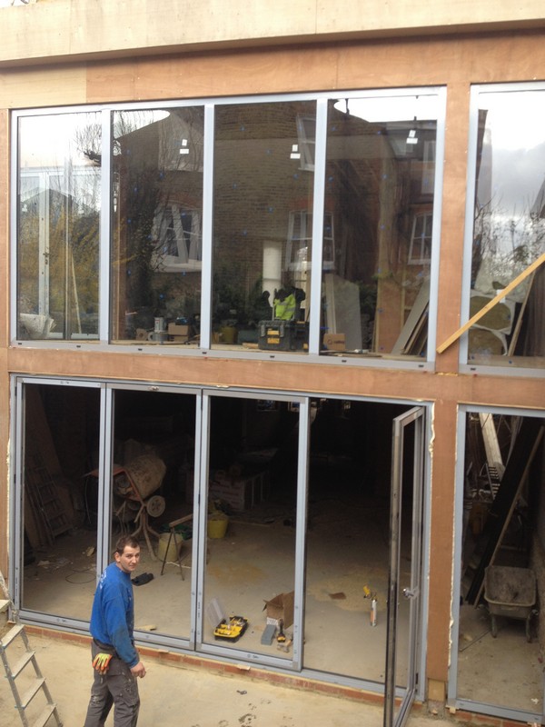 Aluminium bi-fold doors with two-storey glazing in Kensal Green