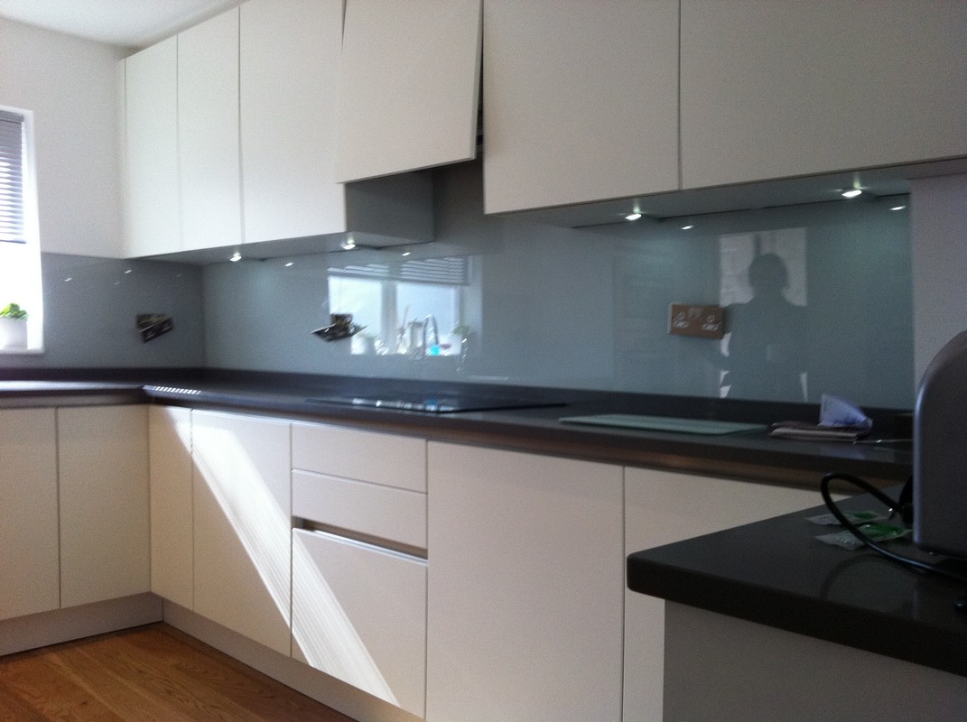 Grey glass kitchen splashback with LED lighting in Kensal Green