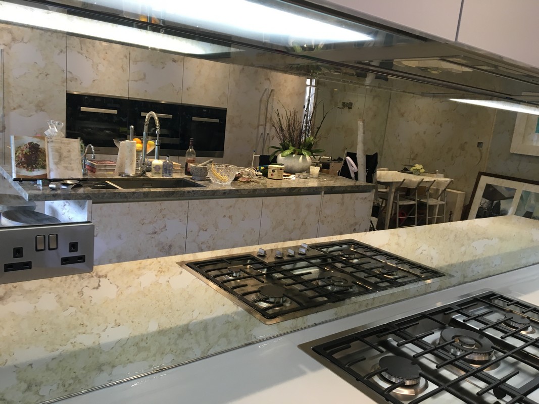 Mirror glass splashback in Kensal Green luxury kitchen