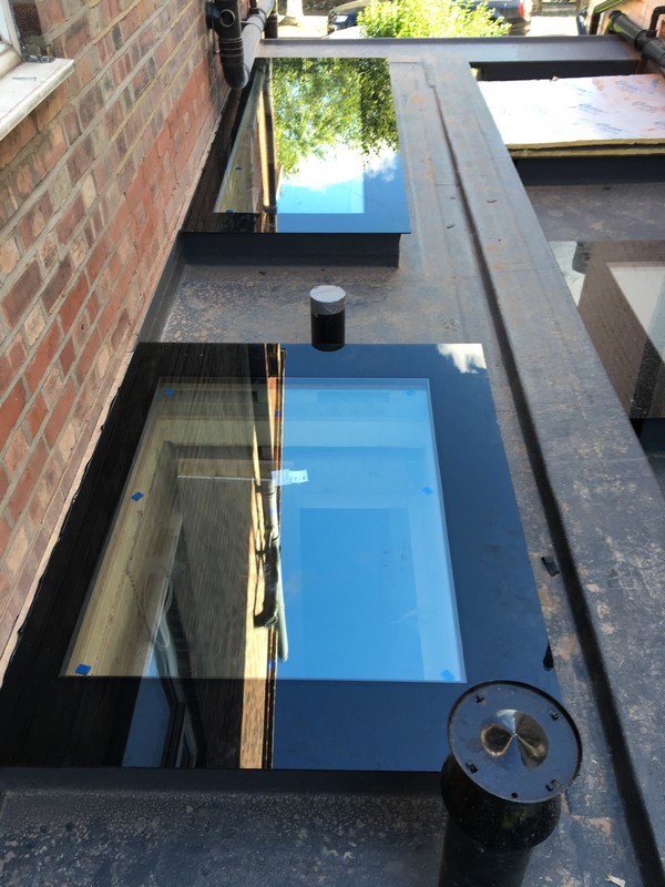 Multiple flat roof skylights on extension in Kensal Green