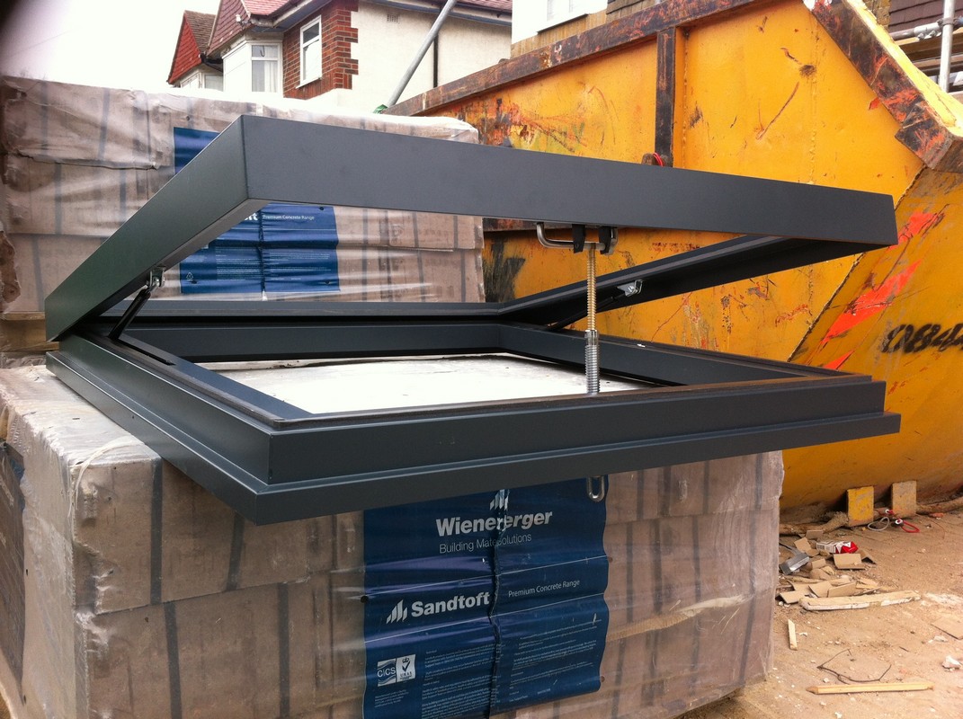 Opening flat roof skylight in anthracite grey installed in Kensal Green